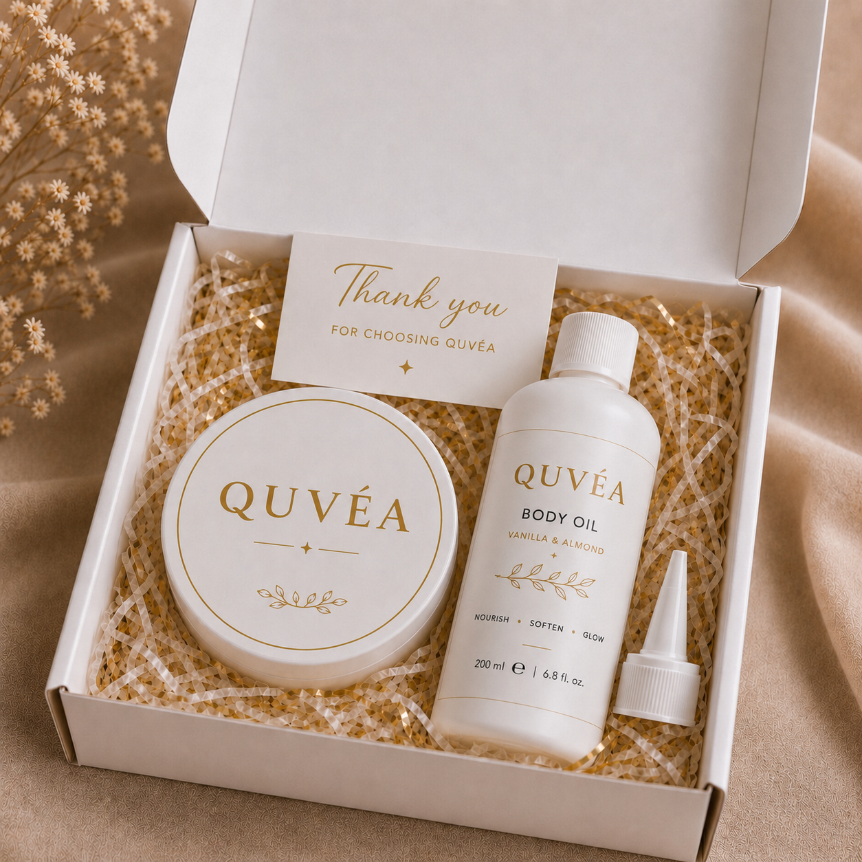 QUVÉA Gift Set box containing the Shea Body Butter jar and Body Oil bottle
